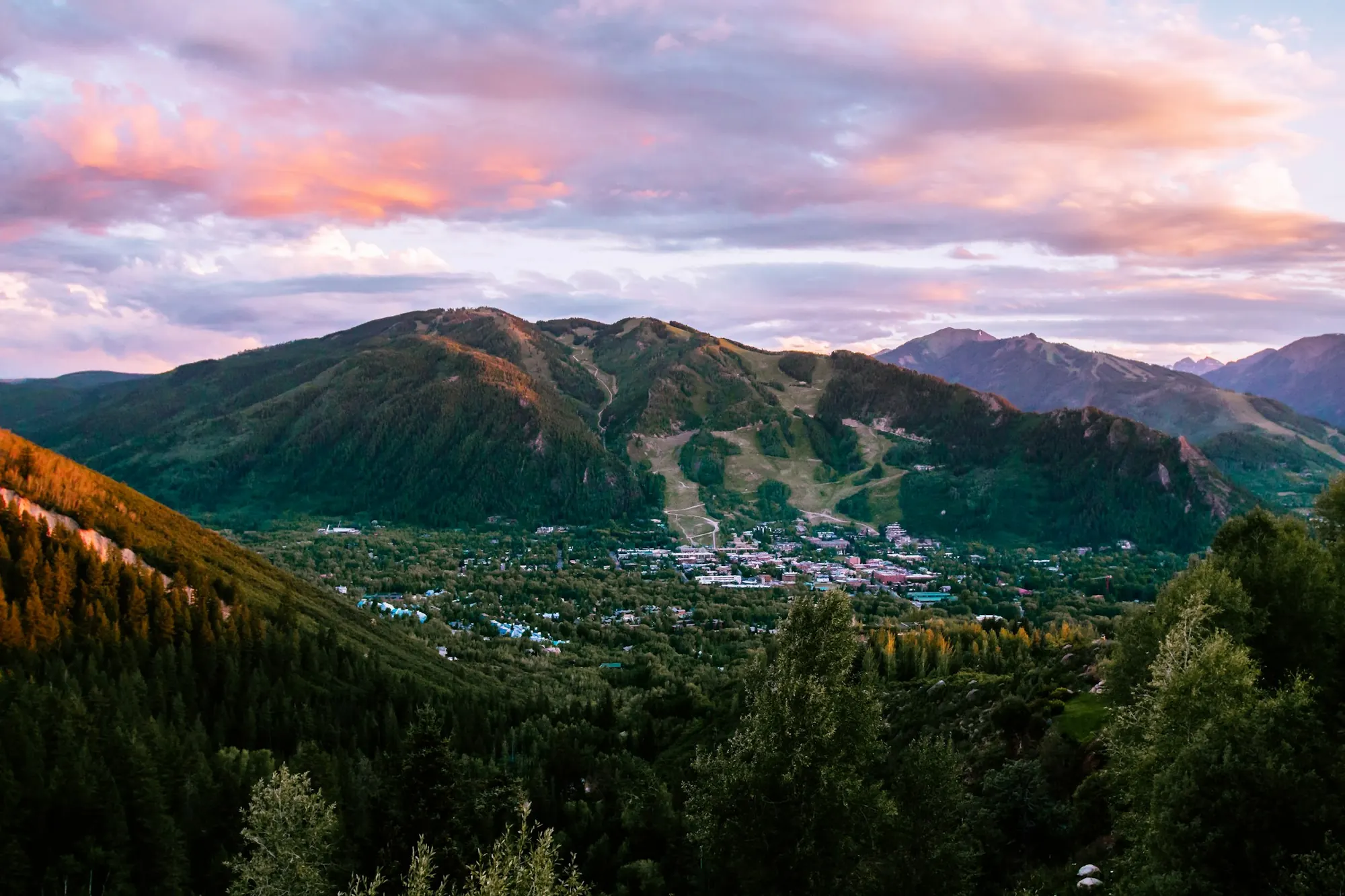 Aspen town at sunset with the mountains behind